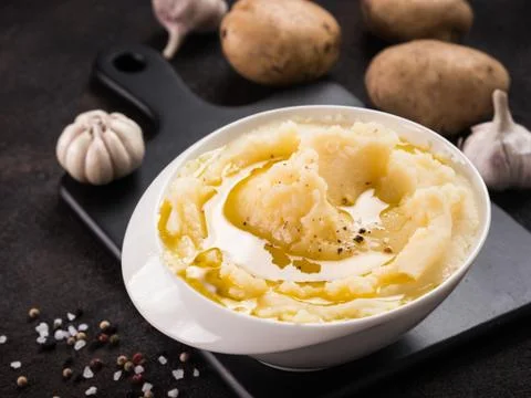 Mashed potatoes on dark concrete background Stock Photos