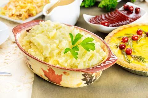 Mashed potatoes on festive dinner table for Thanksgiving Day. Stock Photos