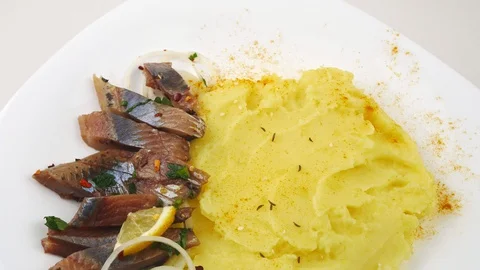 Mashed potatoes with fillet of Atlantic herring and onions. Stock Footage 128290974