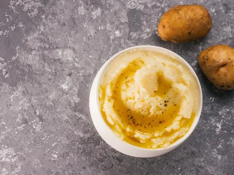 Mashed potatoes on gray concrete background Фото