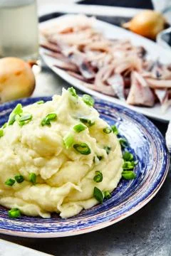 Mashed potatoes with herring and pickled onions Stock Photos
