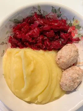 Mashed potatoes with meatballs. Top view Stock Photos