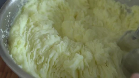 Mashed potatoes in a saucepan. Beating mashed potatoes with a mixer. Stock Footage 341550707