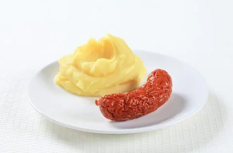 Mashed potatoes with sausage on a plate Stock Photos