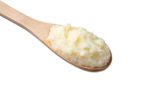 Mashed potatoes in a spoon isolated over white background Stock Photos