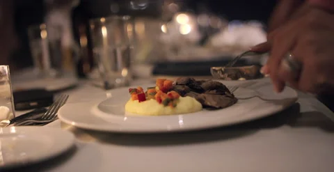 Mashed potatoes, steak, mushrooms, and vegetables in candlelit dinner￼ 스톡 동영상 202260059