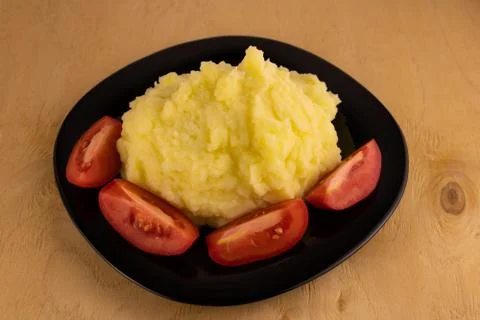 Mashed potatoes with tomato slices Stock-Fotos