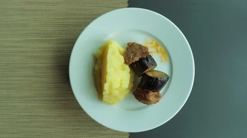 Mashed potatoes, vegetables and meat balls as a useful concept food. The plat Vídeos de archivo 110656073