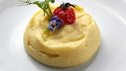 Mashed potatoes on a white plate Stock Photos