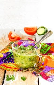 Mashed tomatoes and cucumbers in a transparent cup Stock Photos