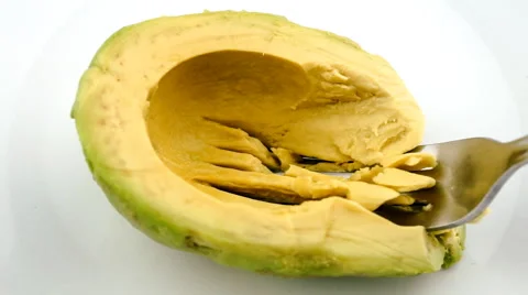 Mashing avocado into paste in slow motion with fork Stock Footage 46962160