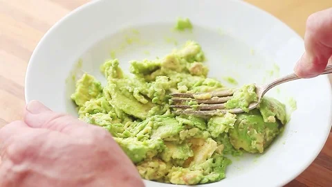 Mashing an avocado point of view Stock Footage 77172311