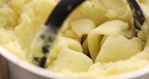 Mashing potatoes in a pot. Stock Footage 249594944
