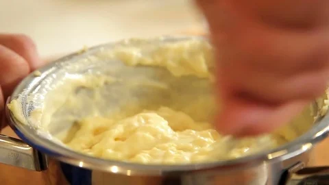 Mashing potatoes in stainless steel saucepan Stock Footage