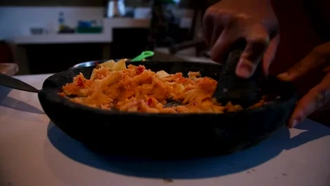 Mashing potatoes with stone 库存影片 279134729
