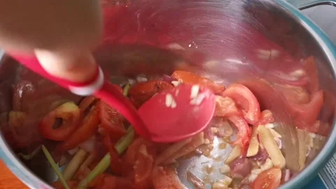 Mashing Tomatoes in a Casserole Stock Footage 159319948