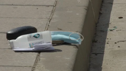 Mask and medical objects thrown on the ground like garbage Stock Footage 150055227