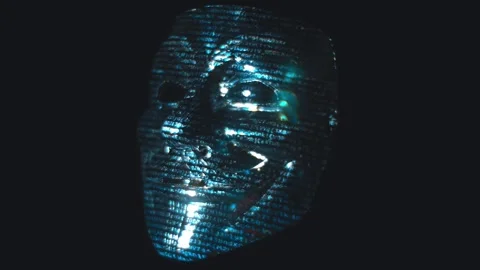 Mask of Anonymous reflects colored patterns and lines of hacker code Stock Footage 313221884