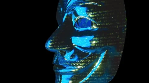 Mask of Anonymous reflects colored patterns and lines of hacker code Stock Footage 313223467