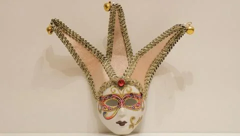 Mask on a beige background Stock Photos