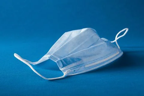 Mask on the blue background Stock Photos