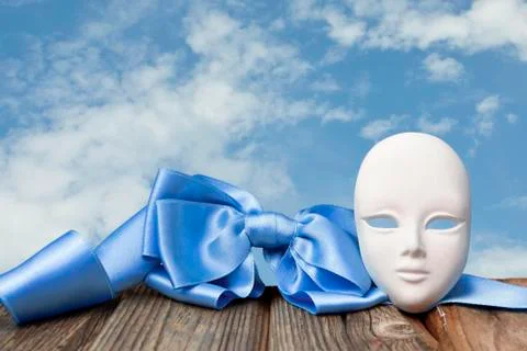 Mask with a blue bow Stock Photos