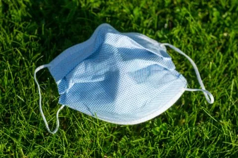 Mask Discarded On Grass Stock Photos