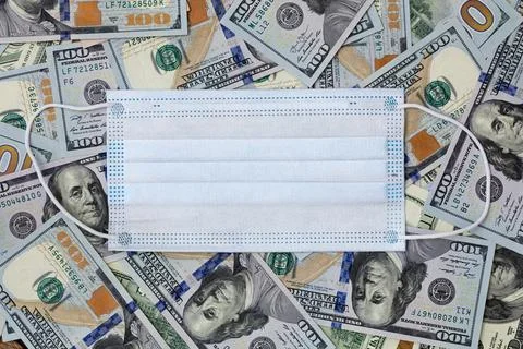 Mask on dollars Stock Photos