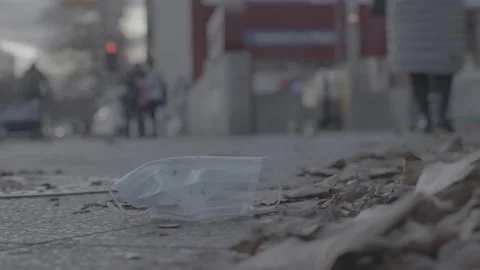 Mask laying on ground, get trampled, city - Coronavirus Covid-19 Epidemic | LOG Stock Footage 165682261