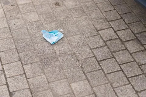 The mask is lying on the road Stock Photos