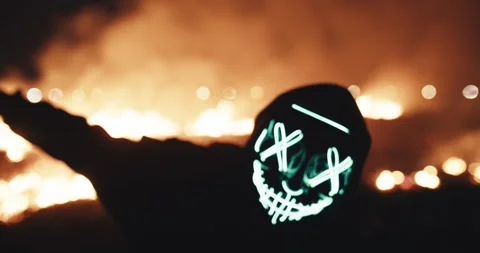 Mask man near fire  Stock Footage 304050641