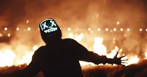 Mask man near fire  Stock Footage 304050697