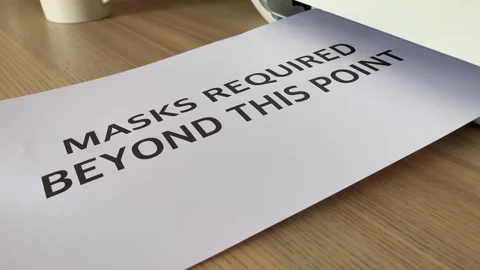 “Mask required beyond this point” black text word in on paper Video stock 249578343