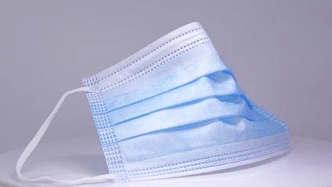 Mask, rotation on a white background Stock Footage 129607211