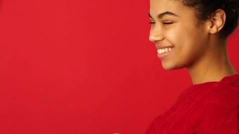 Mask off. Side view of beautiful mixed race girl taking off protective face mask Stock Footage 146128976