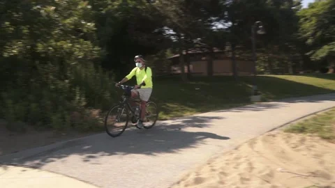 Masked cyclist Stock Footage 134501612