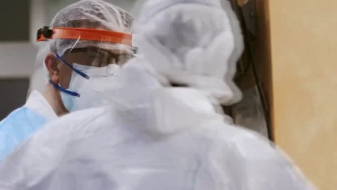 Masked doctors communicate with each other Stock Footage 133380424