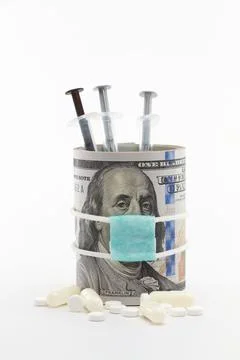 Masked dollar on white background 库存照片