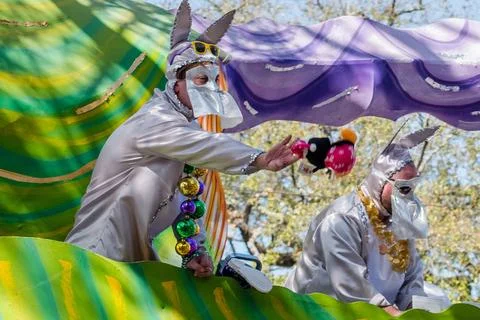 Masked Float Rider Throwing to Spectators at Mardi Gras Parade Stock Photos