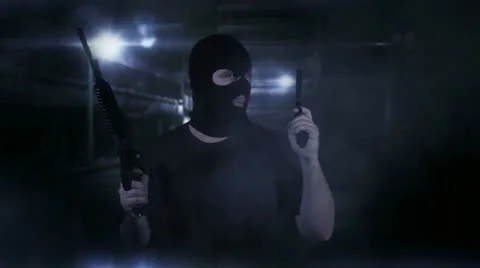 Masked Guard Man with Double Guns in Scary Alley Stock Footage 20501814
