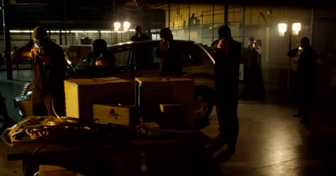 Masked Gunman Open Fire Inside Warehouse Stock Footage 60681959
