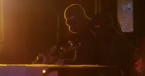 Masked Gunman Open Fire Inside Warehouse - Profile Stockbeeldmateriaal 60682034