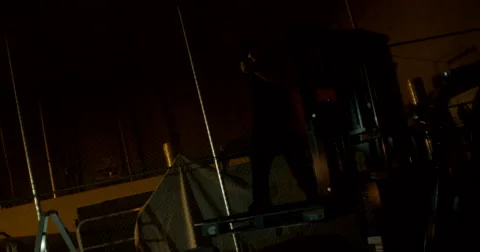 Masked Gunmen Falls Off Forklift Inside Warehouse Stockbeeldmateriaal 60681353