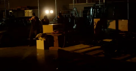Masked Gunmen Take Fire Inside Warehouse Stockbeeldmateriaal 60682345