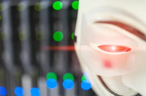 Masked Hacker in Computer Server room Concept Stock Photos