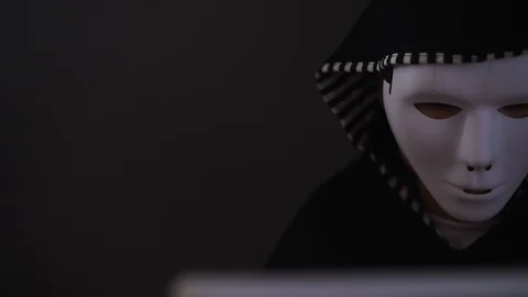 Masked Hacker is Using Computer Stock Footage 97448561