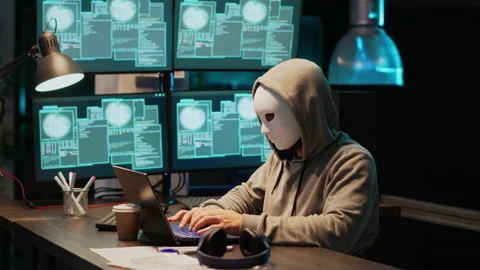 Masked hacking thief stealing information from database server Stock Footage 229333768