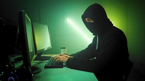 Masked Hacktivist Organizes Massive Data Breach Attack on Corporate Servers Stock Footage 111287694