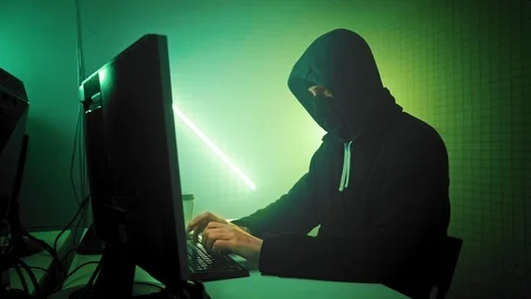 Masked Hacktivist Organizes Massive Data Breach Attack on Corporate Servers Video stock 112299517