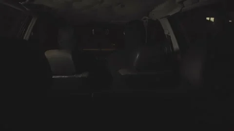 Masked killers in a car with weapons at night. Killers in the car are waiting Stock Footage 164558454